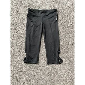 Girls RBX black active capri pants with cutouts at the bottom, size 7/8